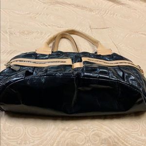 See By Chloe black patent bag with beige accents